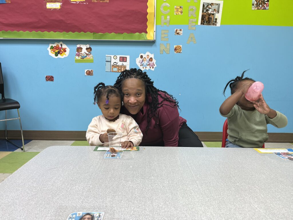 Ms. Tiffany toddler 1 teacher with student