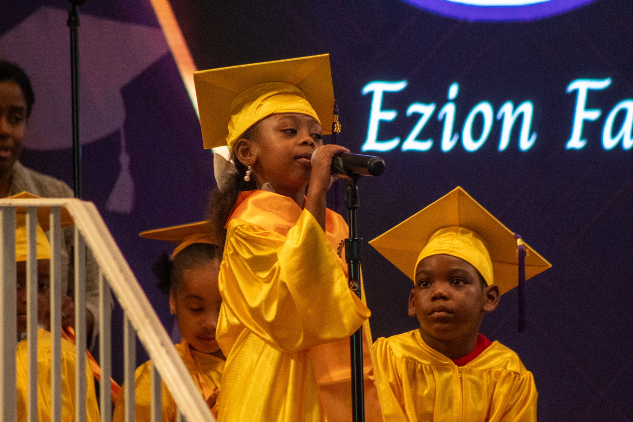 Prek-4 student speaking at graduation ceremony